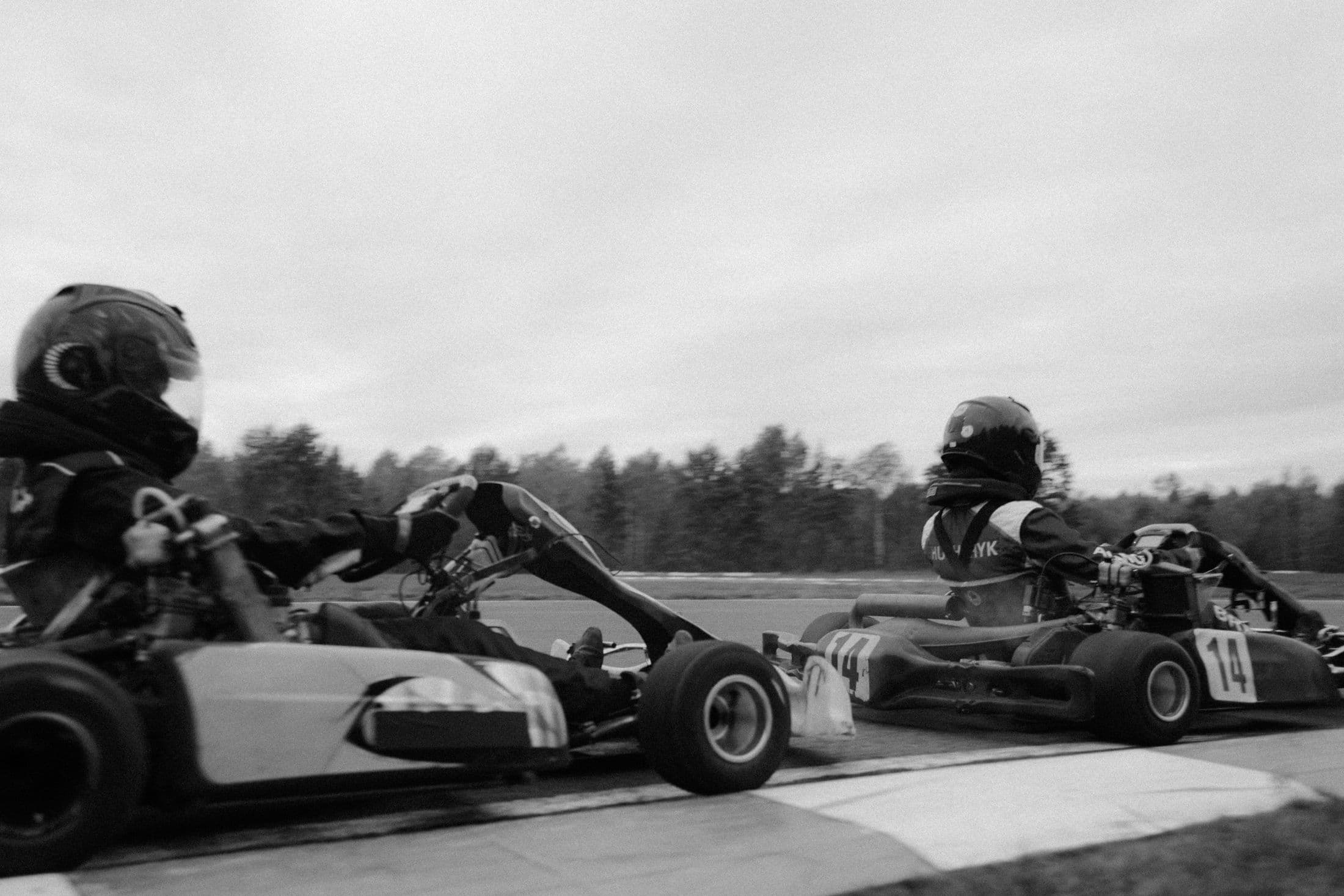 Karts racing wheel to wheel on track