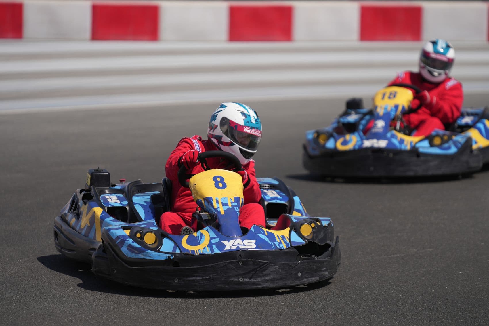 Young drivers racing karts